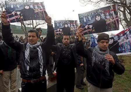 Members of civil society organisations chant slogans during a protest to condemn the killing of 27-year-old woman, Farkhunda, who was beaten with sticks and set on fire by a crowd of men in central Kabul in broad daylight on Thursday, in Kabul, in this file picture taken March 24, 2015. REUTERS/Omar Sobhani/Files