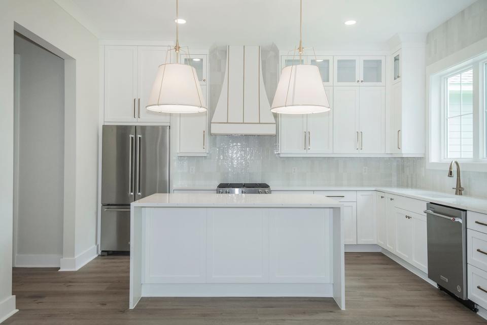 Hone chefs will love the large island and chic kitchen design.