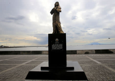 A memorial statue that commemorates the Filipino "comfort women" who worked in Japanese military brothels during World War II stands erected along a main street of Roxas Boulevard, Metro Manila, Philippines January 12, 2018. A message reads "This monument is in honor of Filipino women who were victims of abuse during the Japanese occupation of the Philippines (1942-1945). A long time has passed before they testified and revealed what they went through". REUTERS/Romeo Ranoco