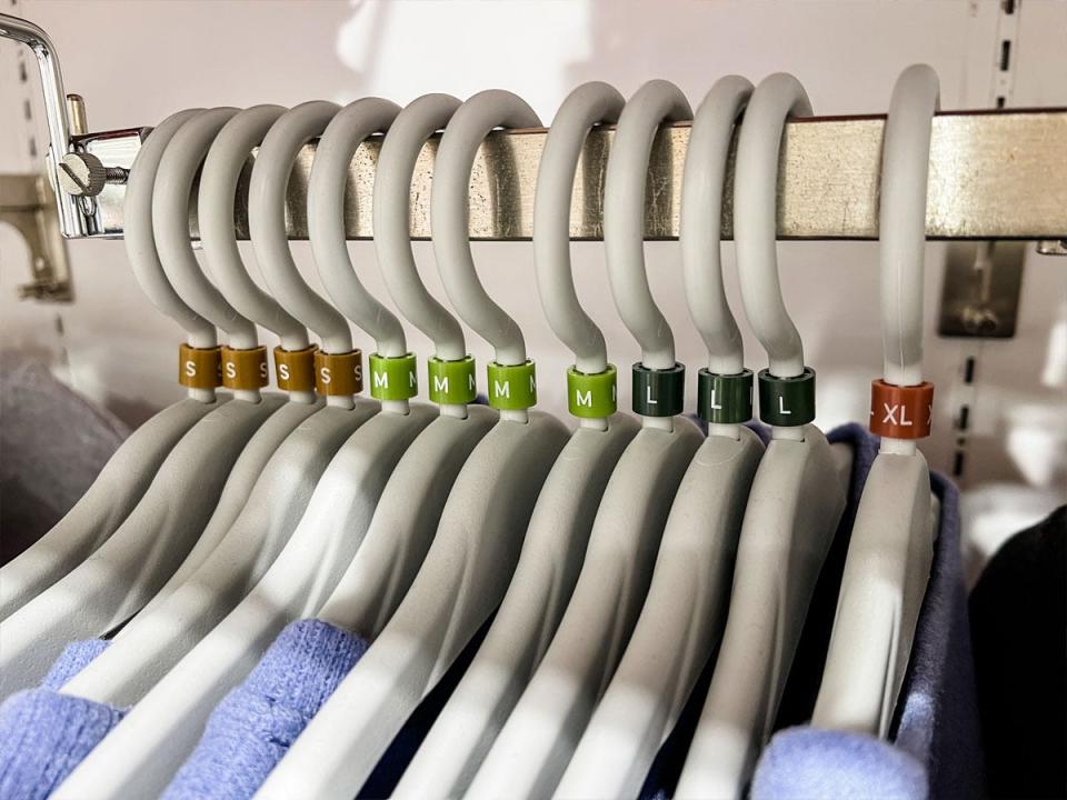 Japanese mall: hangers on rack with sizes