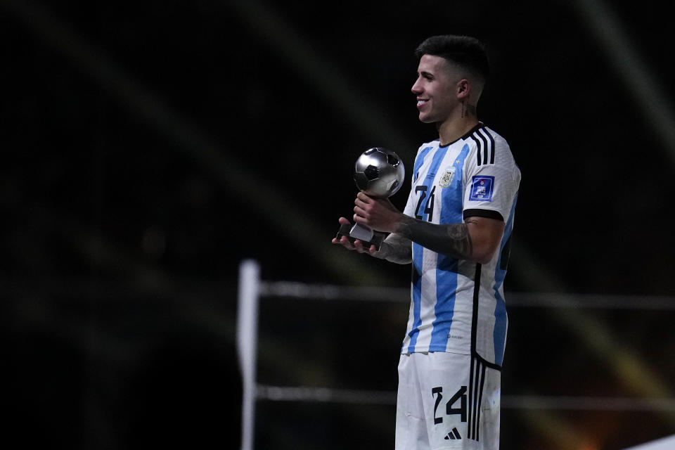 Argentina's Enzo Fernandez holds the young player award for best under 21 player of the after Argentina defeated France in the World Cup final soccer match at the Lusail Stadium in Lusail, Qatar, Sunday, Dec. 18, 2022. (AP Photo/Natacha Pisarenko)