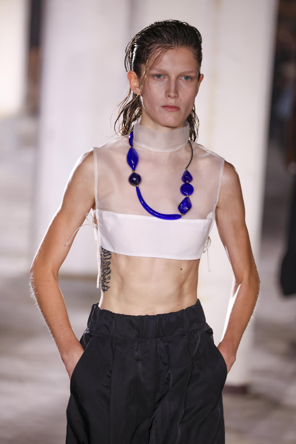 A model wears a creation for the Dries Van Noten ready-to-wear Spring/Summer 2023 fashion collection presented Wednesday, Sept. 28, 2022 in Paris. (Photo by Vianney Le Caer/Invision/AP)