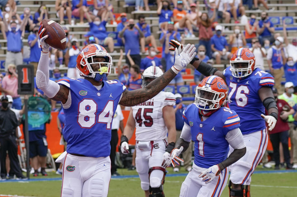 Florida tight end Kyle Pitts (84) celebrates a 4-yard touchdown catch against South Carolina during the first half of an NCAA college football game, Saturday, Oct. 3, 2020, in Gainesville, Fla. (AP Photo/John Raoux, Pool)