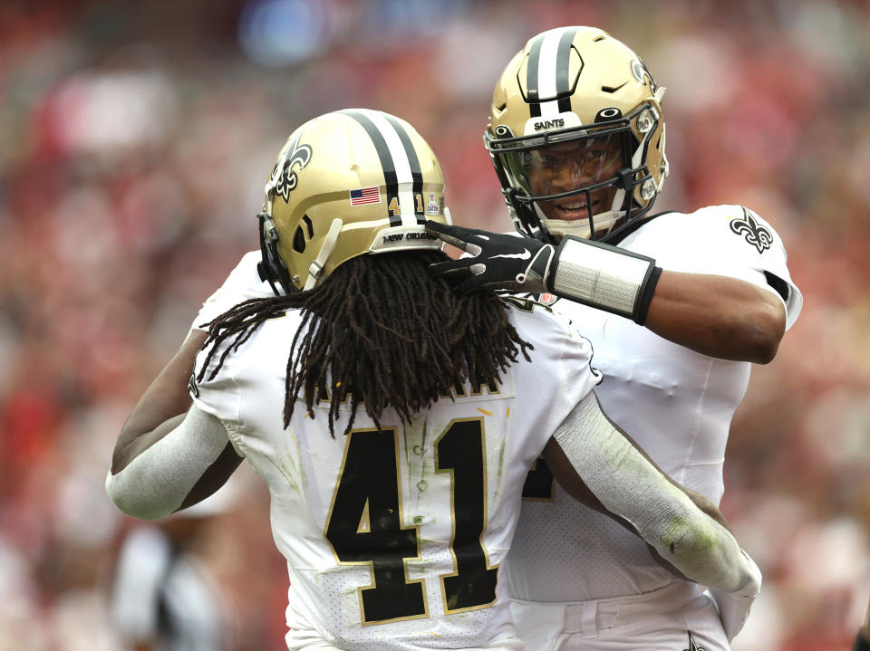 LANDOVER, MARYLAND - OCTOBER 10: Jameis Winston #2 of the New Orleans Saints and Alvin Kamara #41 celebrates during the first half against the Washington Football Team at FedExField on October 10, 2021 in Landover, Maryland. (Photo by Rob Carr/Getty Images)