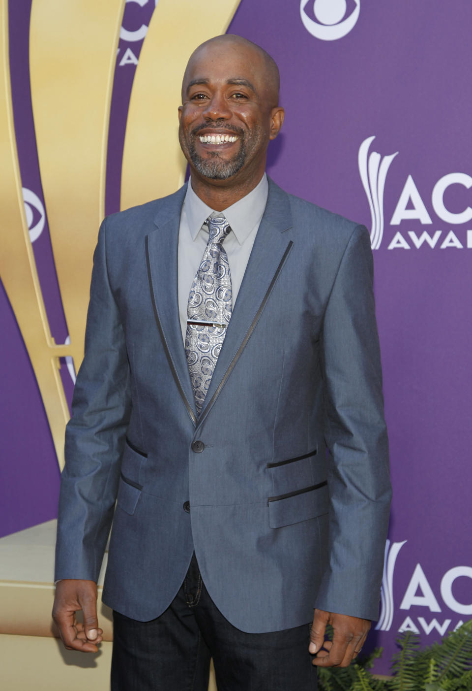 FILE - In this April 1, 2012 file photo, Darius Rucker arrives at the 47th Annual Academy of Country Music Awards in Las Vegas. Rucker was surprised Tuesday night, Oct. 2, 2012 by Brad Paisley, who invited Rucker to become a member of the Grand Ole Opry. (AP Photo/Isaac Brekken, File)