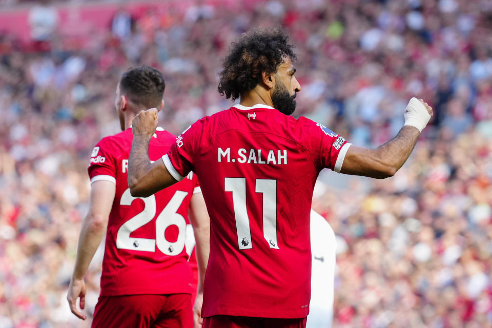 Liverpool's Mohamed Salah celebrates after scoring his side's third goal during the English Premier League soccer match between Liverpool and Aston Villa at Anfield stadium in Liverpool, Sunday, Sept. 3, 2023. (AP Photo/Jon Super)