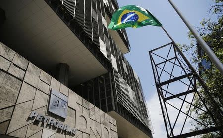 A tower with a Brazilian flag representing an oil rig is pictured during a protest in front of the Petrobras headquarters in Rio de Janeiro March 4, 2015. REUTERS/Sergio Moraes