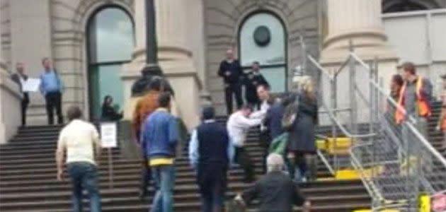 Claims MP Geoff Shaw physically assaulted a taxi protester on the steps of Victorian Parliament. Photo: 7News