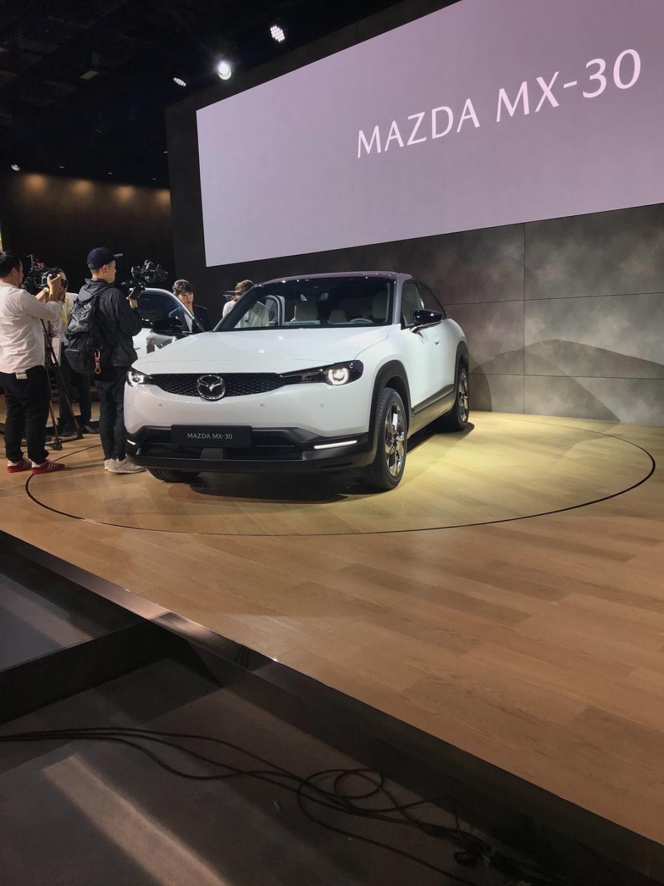 <p>It should be no surprise that <a href="https://www.caranddriver.com/news/a29555758/mazda-mx-30-concept-photos-info/" rel="nofollow noopener" target="_blank" data-ylk="slk:Mazda's first fully electric model;elm:context_link;itc:0;sec:content-canvas" class="link ">Mazda's first fully electric model</a> debuted in Tokyo. The surprising part doesn't happen until you start opening its doors. Like Mazda's past sports car, the RX-8, the MX-30 has small rear-hinged doors for the second row that open suicide-style. It could be considered an extended-cab coupe at this point. Mazda didn't have much to say about its electric powertrain, other than it's equipped with a 35.5-kWh lithium-ion battery pack. No speculation on range or recharging times yet. European buyers can preorder it now while U.S. buyers will have to wait until late next year.</p>