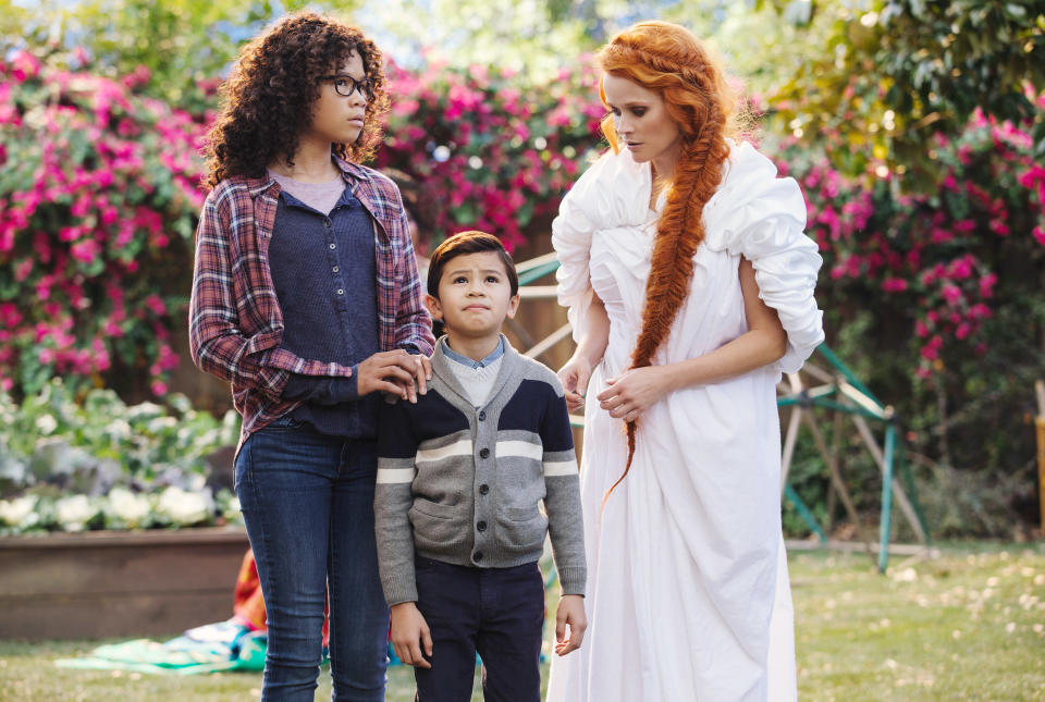 siblings talking to Reese Witherspoon's character dressed all in white