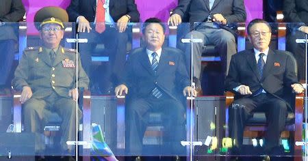 Hwang Pyong So (L-R), director of the North Korean army's General Political Bureau, Choe Ryong Hae, a secretary of the central committee of the Workers' Party of North Korea, and Kim Yang Gon, director of the United Front Department of the ruling Workers' Party of North Korea, attend the closing ceremony of the 17th Asian Games at the Incheon Asiad Main Stadium October 4, 2014. REUTERS/Hwang Gwang-mo/Yonhap