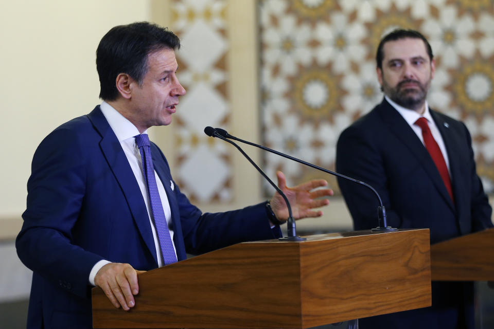 Italian Prime Minister Giuseppe Conte, left, speaks during a joint press conference with his Lebanese counterpart Saad Hariri, at the Government House in Beirut, Lebanon, Thursday, Feb. 7, 2019. (AP Photo/Bilal Hussein)