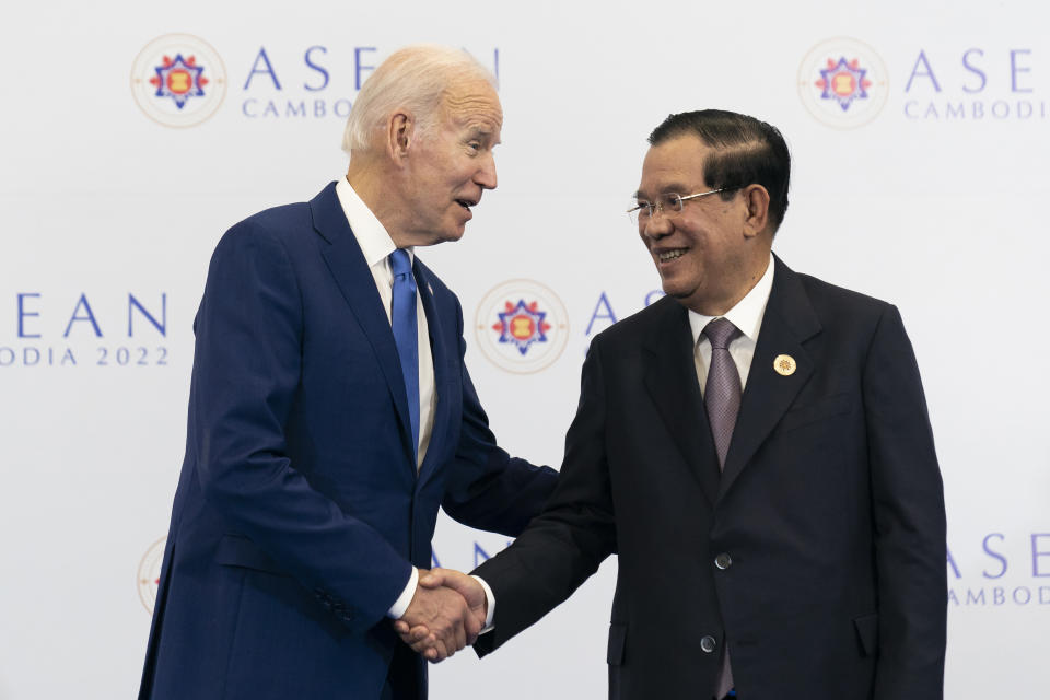 FILE - U.S. President Joe Biden shakes hands with Cambodian Prime Minister Hun Sen before their meeting during the Association of Southeast Asian Nations (ASEAN) summit, Saturday, Nov. 12, 2022, in Phnom Penh, Cambodia. Hun Sen said Tuesday, Nov. 15, 2022, he has tested positive for COVID-19 at the Group of 20 meetings in Bali, just days after hosting many world leaders, including President Joe Biden, for a summit in Phnom Penh. (AP Photo/Alex Brandon, File)