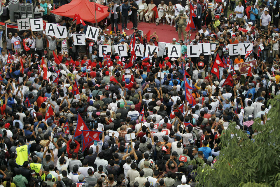Nepalese Newar community people gather during a protest against government in Kathmandu, Nepal, Wednesday, June 19, 2019. Thousands of people protested in the Nepalese capital to protest a Bill that would give government control over community and religious trusts. Protesters demanded the government scrap the proposed Bill to protect these trusts that hold religious ceremonies and festivals. (AP Photo/Niranjan Shrestha)