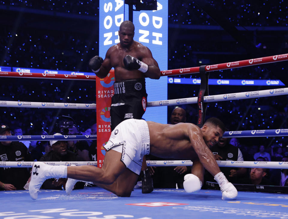 Boxing - Daniel Dubois v Anthony Joshua - IBF World Heavyweight Title - Wembley Stadium, London, Britain - September 21, 2024 Anthony Joshua gets knocked down by Daniel Dubois Action Images via Reuters/Andrew Couldridge