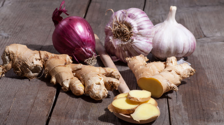 onion, garlic, and ginger on wooden table