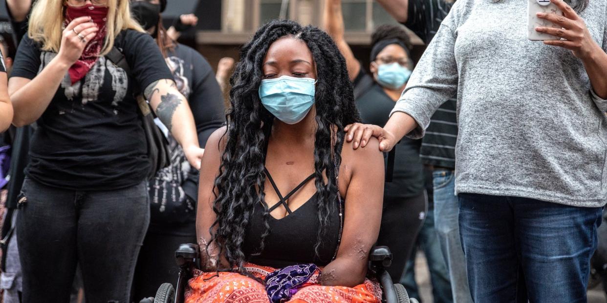 Whitney Mitchell, Garrett Foster's fiancée, attends a vigil for Garrett Foster on July 26, 2020 in downtown Austin, Texas. Garrett Foster, 28, who was armed and participating in a Black Lives Matter protest, was shot and killed after a chaotic altercation with a motorist who allegedly drove into the crowd.