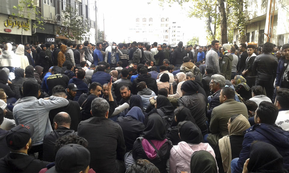 Protestors attend a demonstration after authorities raised gasoline prices, in the northern city of Sari, Iran, Saturday, Nov. 16, 2019. Protesters angered by Iran raising government-set gasoline prices by 50% blocked traffic in major cities and occasionally clashed with police Saturday after a night of demonstrations punctuated by gunfire. (Mostafa Shanechi/ ISNA via AP)