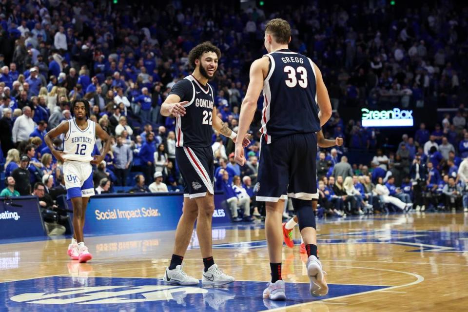 Gonzaga’s Anton Watson (22) celebrates his team’s defeat of Kentucky with teammate Ben Gregg (33) on Saturday at Rupp Arena.