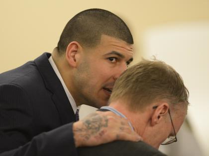 Aaron Hernandez talks with his attorney Charles Rankin during his murder trial. (AP)