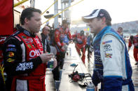 HOMESTEAD, FL - NOVEMBER 20: (L-R) Tony Stewart, driver of the #14 Office Depot/Mobil 1 Chevrolet, and Bobby Labonte, driver of the #47 Reese Towpower Toyota, talk during the reg flag rain delay during the NASCAR Sprint Cup Series Ford 400 at Homestead-Miami Speedway on November 20, 2011 in Homestead, Florida. (Photo by Chris Graythen/Getty Images)