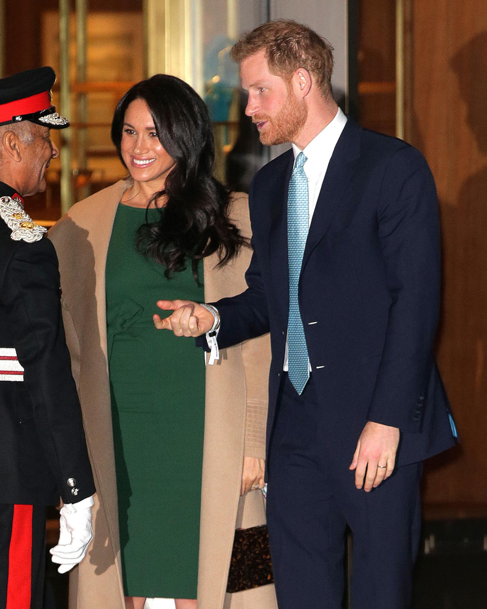 Prince Harry and Meghan Markle greet folks at an engagement