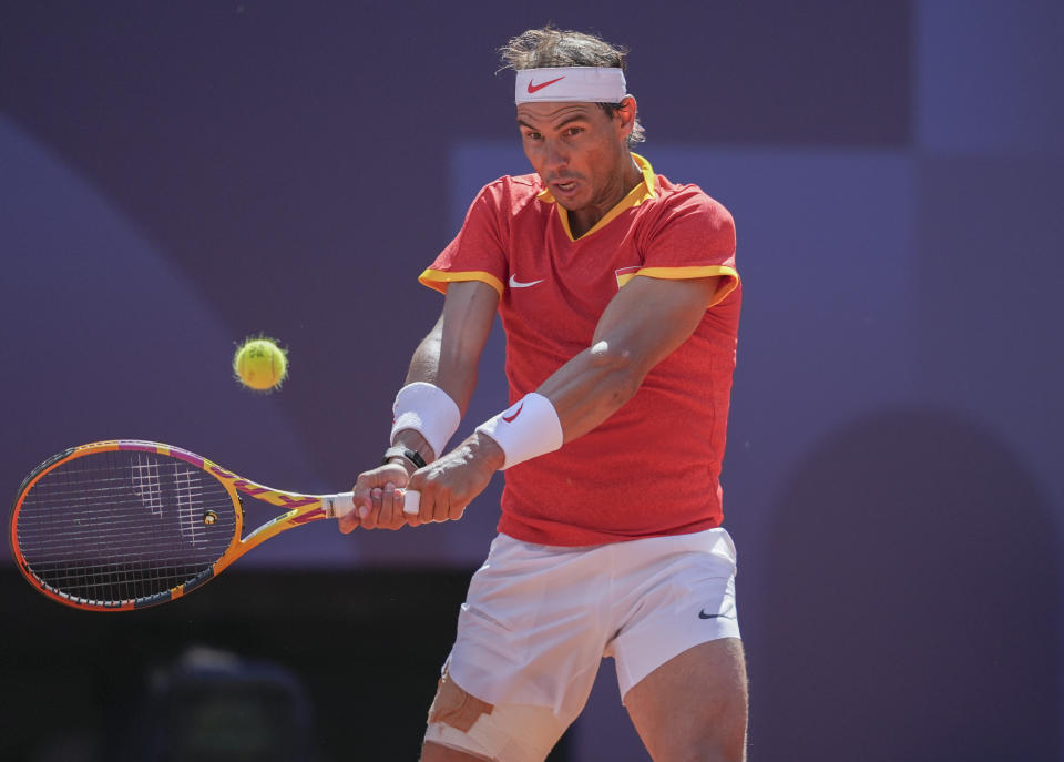 PARIS, FRANCE - JULY 28: Spain's Rafael Nadal and Hungary's Marton Fucsovics (not seen) compete during their men's singles first round tennis match on Court Philippe-Chatrier at the Roland-Garros Stadium at the Paris 2024 Olympic Games, in Paris, France on July 28, 2024. (Photo by Mustafa Cifti/Anadolu via Getty Images)