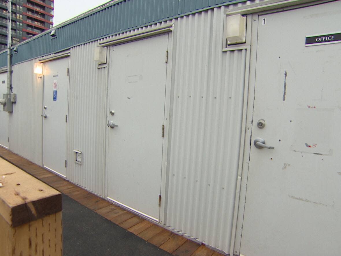 A new, temporary modular facility offers access to showers, toilets, and laundry services to people experiencing homelessness in Surrey, B.C. (Mike Zimmer/CBC - image credit)