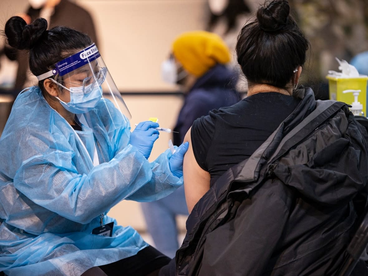 About six million Ontarians who had a COVID-19 vaccine booster shot last winter are currently ineligible to get another shot now because of provincial policy. Some doctors are calling on the province to make all adults eligible for a fourth dose, as Quebec did in May.   (Evan Mitsui/CBC - image credit)