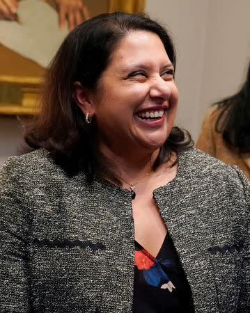 Neomi Rao (C), the administrator of the White House Office of Information and Regulatory Affairs, reacts after U.S. President Donald Trump announced that he is nominating her to replace Supreme Court Justice Brett Kavanaugh on the U.S. D.C. Circuit Court of Appeals during a Diwali ceremony at the White House in Washington, U.S. November 13, 2018. REUTERS/Jonathan Ernst