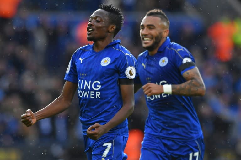 Leicester City's midfielder Ahmed Musa (L) celebrates with defender Danny Simpson after scoring on October 22, 2016