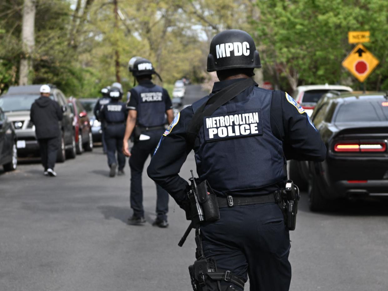 Police officers respond to an alleged shooting near the 2900 block of Van Ness Street in Northwest, Washington, DC on April 22, 2022.