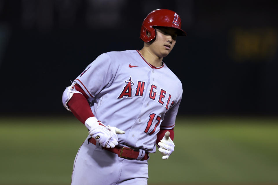 Los Angeles Angels' Shohei Ohtani runs the bases after hitting a home run against the Oakland Athletics during the seventh inning of a baseball game in Oakland, Calif., Tuesday, Aug. 9, 2022. (AP Photo/Jed Jacobsohn)