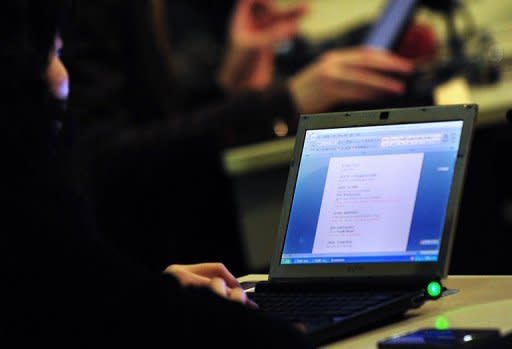 Journalists work on their laptop computers in Beijing in March 2011. A worldwide test of the next generation of Internet addresses was underway on Wednesday to replace the dwindling reservoir of numbers in the original system