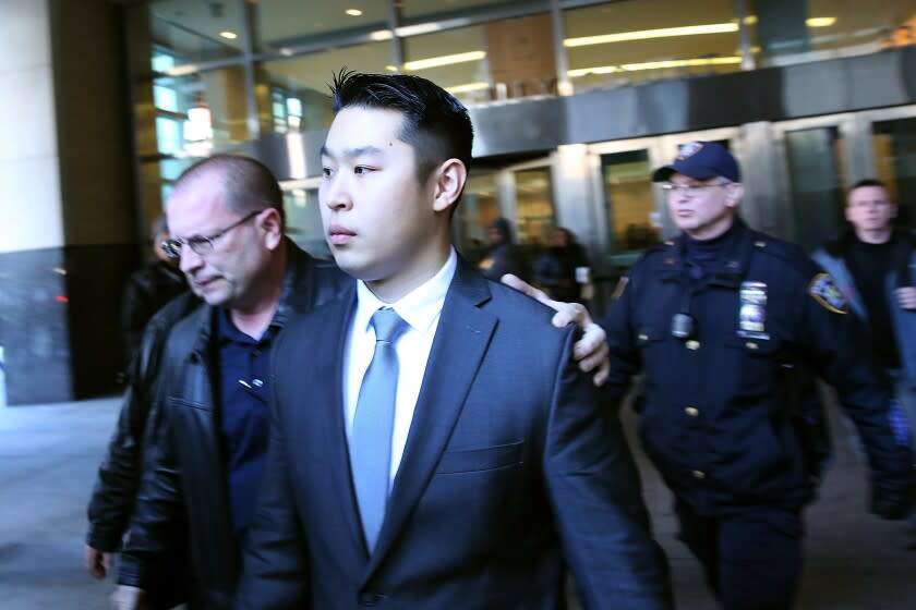 NEW YORK, NY - FEBRUARY 11: New York City police officer Peter Liang is escorted out of court after he was charged with manslaughter, official misconduct and other offenses on February 11, 2015 in the Brooklyn borough of New York City. Liang pleaded not guilty Wednesday in the November 20 death of 28-year-old Akai Gurley. Liang claims he fired his gun accidentally in a stairwell in the Pink Houses, a public housing complex in East New York. Liang was released without bail. The Brooklyn courtroom was packed with officers and protesters. (Photo by Spencer Platt/Getty Images)