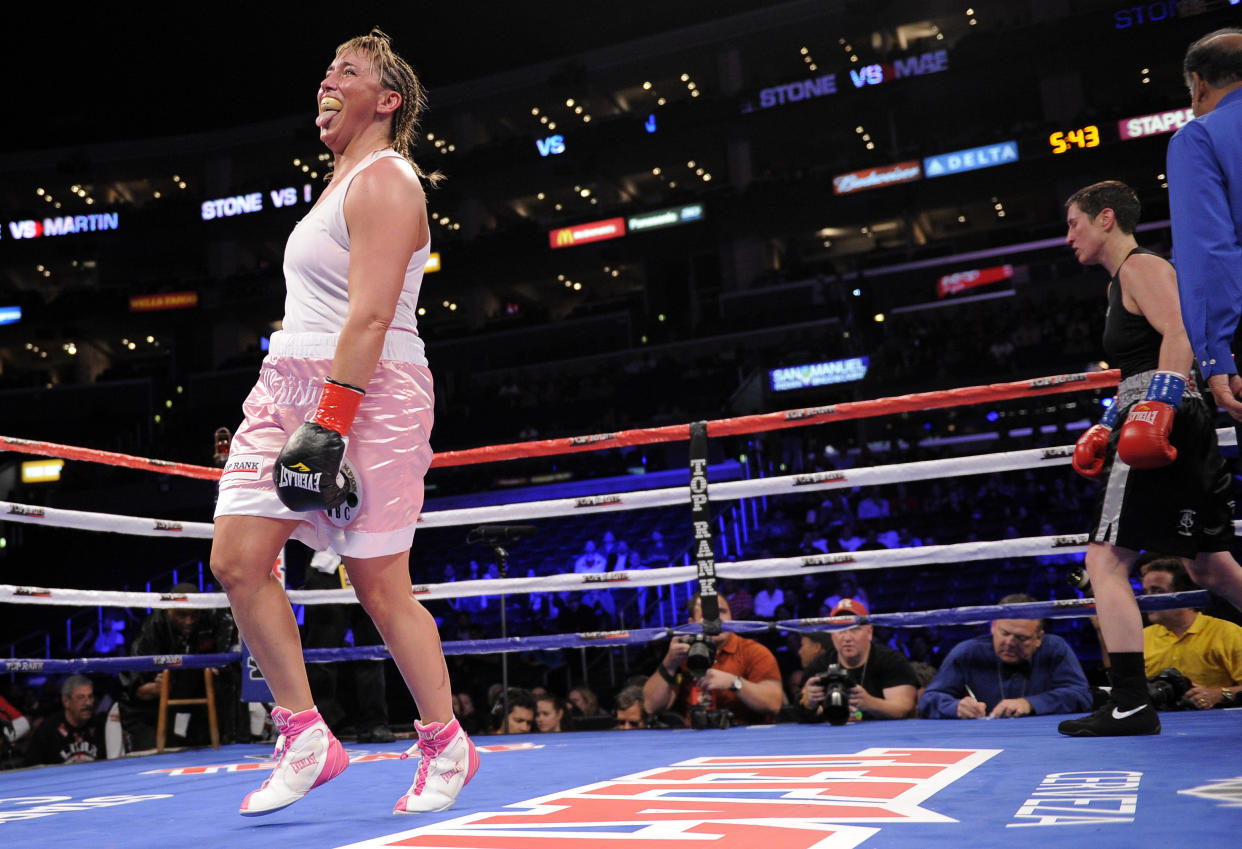 Christy Martin, left, reacts after finishing the fifth round against Dakota Stone during their Welterweight boxing match, Saturday, June 4, 2011, in Los Angeles. 