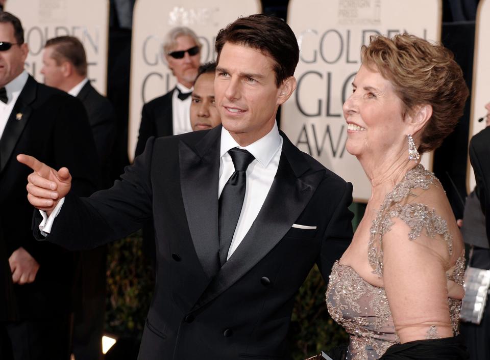 Actor Tom Cruise, center, and his mother  Mary Lee Mapother arrive at the 66th Annual Golden Globe Awards on Sunday, Jan. 11, 2009, in Beverly Hills, Calif. (AP Photo/Chris Pizzello)