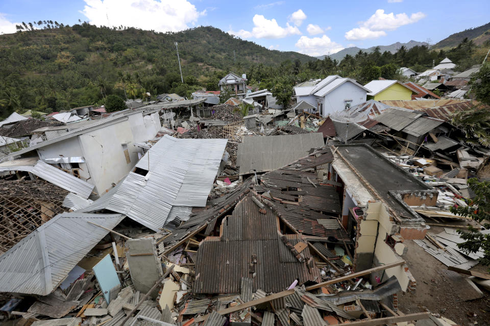 <p>Houses damaged by an earthquake are seen in North Lombok, Indonesia, Tuesday, Aug. 7, 2018. (Photo: Tatan Syuflana/AP) </p>