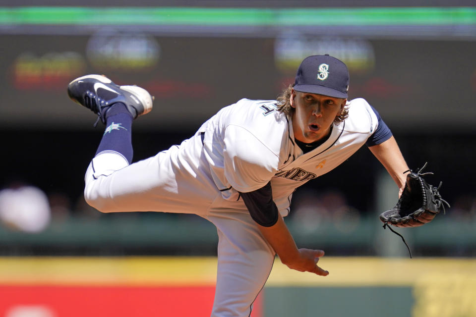 Seattle Mariners starting pitcher Logan Gilbert follows through with a pitch against the Houston Astros in the second inning of a baseball game Wednesday, Sept. 1, 2021, in Seattle. (AP Photo/Elaine Thompson)