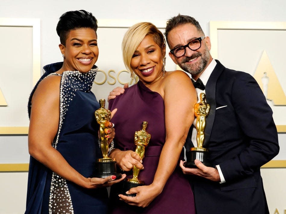 Mia Neal, Jamika Wilson Sergio Lopez-Rivera pose with their Oscars.