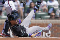 Arizona Diamondbacks second baseman Ketel Marte falls while batting in the first inning of a baseball game against the Atlanta Braves Sunday, April 7, 2024, in Atlanta. (AP Photo/John Bazemore)