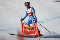 Italy's Sofia Goggia leaves the course of an alpine ski, women's World Cup super-G race in Cortina d'Ampezzo, Italy, Sunday, Jan. 23, 2022. (AP Photo/Gabriele Facciotti)