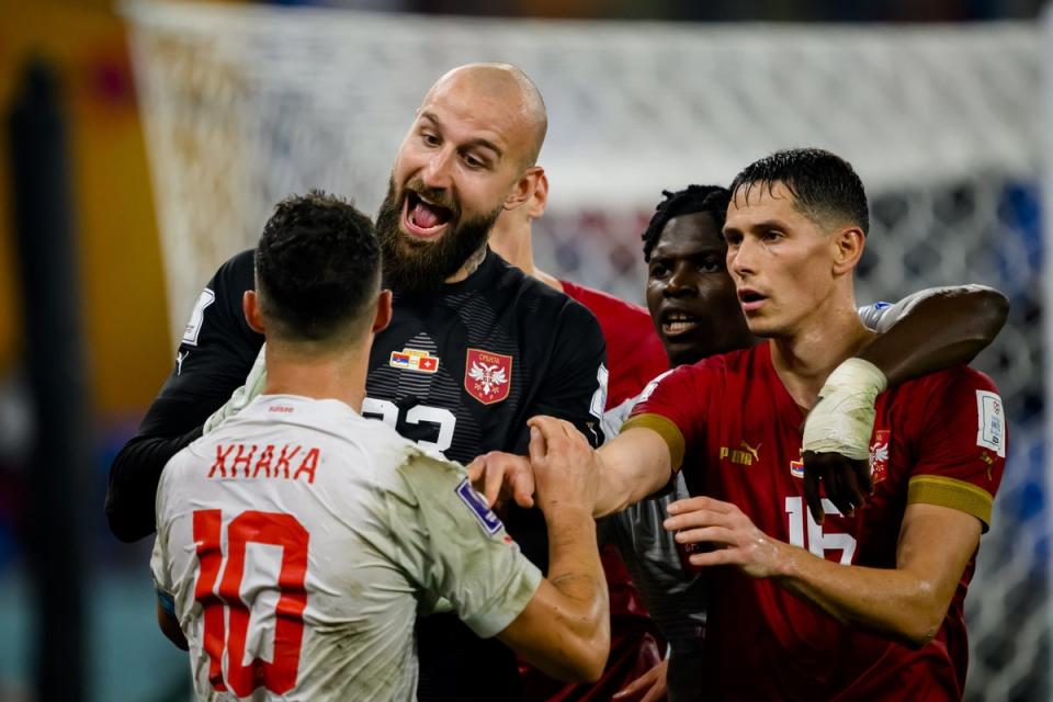 Granit Xhaka argues with Serbia's goalkeeper Vanja Milinkovic-Savic (EPA)