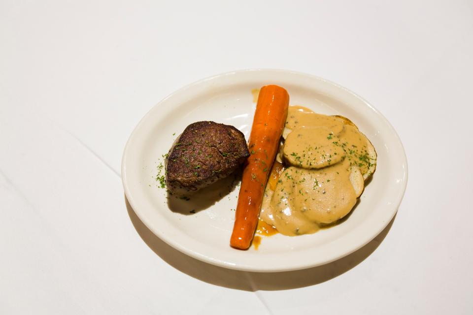 Glazed carrot served with filet mignon and skillet potatoes at Bob's Steak and Chop House at the Omni Hotel on Thursday, July 19, 2018.