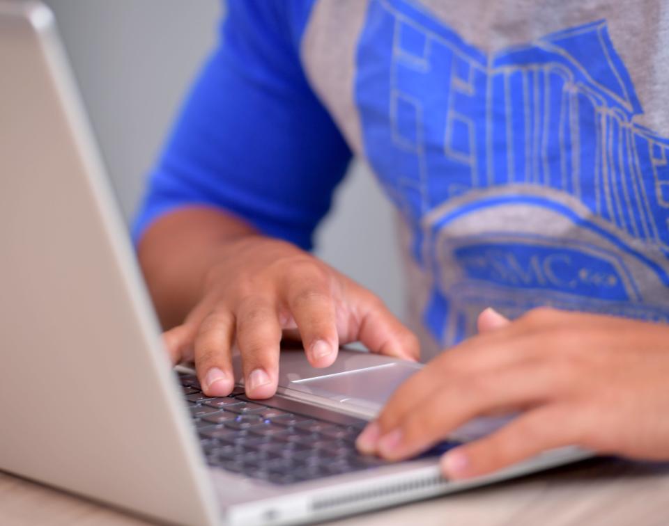 Spartanburg Methodist College financial aid director Kyle Wade talks about the FAFSA, one-on-one sessions available for high school seniors offered by the school. Here, a student looks over his FAFSA information online.