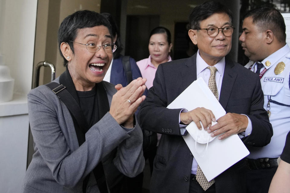 Filipino journalist Maria Ressa, 2021 Nobel Peace Prize winner and Rappler CEO, gestures as she faces reporters after being acquitted by the Pasig Regional Trial Court over a tax evasion case in Pasig city, Philippines on Tuesday, Sept. 12, 2023. (AP Photo/Aaron Favila)