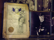 <p>An announcement for a dinner for athletes from the 1920 Antwerp summer Olympics hosted by then New York Mayor John F. Hylan is shown, left, inside a glass-enclosed case at the Waldorf Astoria hotel, Tuesday, Feb. 28, 2017, in New York. Those who slept in luxury at the Waldorf over the years have included celebrities from Marilyn Monroe and Grace Kelly to Cole Porter, who left his Steinway ivories behind. It was a regular stop for foreign heads of state, royalty and corporate kings. Long-term residents have included former presidents Herbert Hoover and Dwight Eisenhower and U.S. Gen. Douglas MacArthur. (Photo: Kathy Willens/AP) </p>