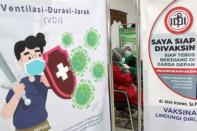 A medical worker receives her second dose of vaccine for the coronavirus disease (COVID-19) at a hospital in Sidoarjo