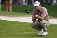 Wyndham Clark lines up his putt on the 18th hole during the second round of the Wells Fargo Championship golf tournament at Quail Hollow on Friday, May 10, 2024, in Charlotte, N.C. (AP Photo/Erik Verduzco)