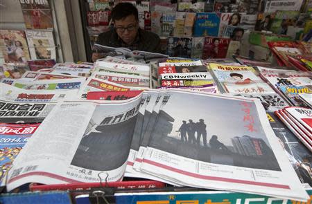 Southern Weekly newspaper copies are left on display at a newsstand in the southern Chinese city of Guangzhou January 7, 2014. REUTERS/Tyrone Siu